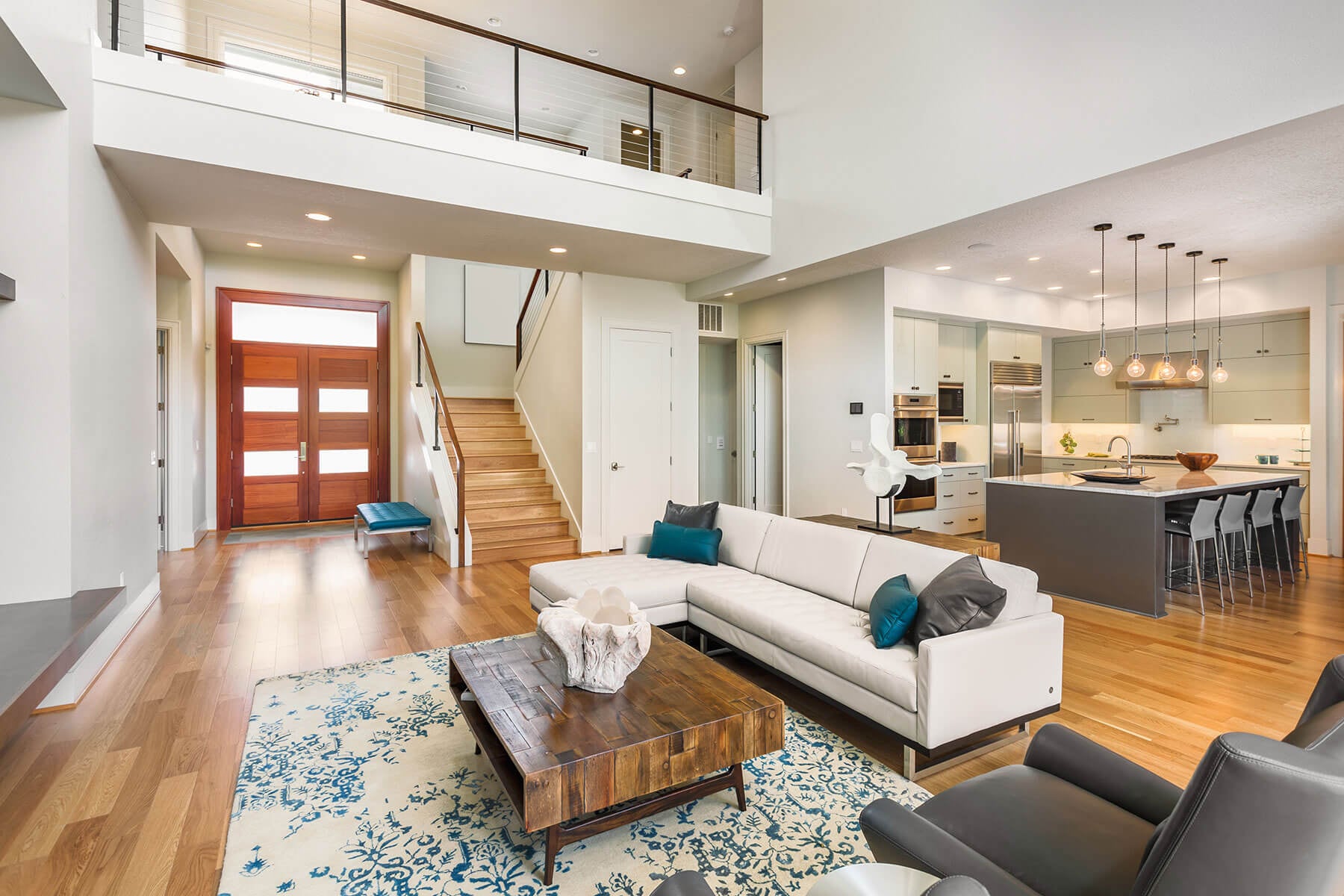 A bright Alaska home with warm hardwood floors throughout the living room